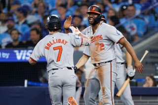 Jimenez and Holliday celebrate home run